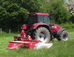 Mowing grass to make hay and silage for winter feed